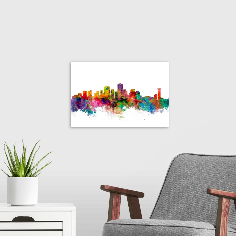 A modern room featuring Watercolor artwork of the New Orleans skyline against a white background.