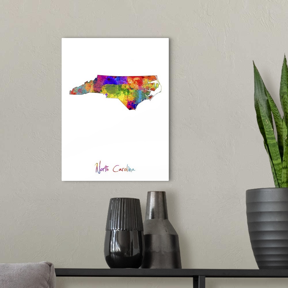 A modern room featuring Contemporary artwork of a map of North Carolina made of colorful paint splashes.