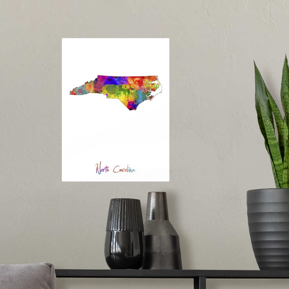 A modern room featuring Contemporary artwork of a map of North Carolina made of colorful paint splashes.