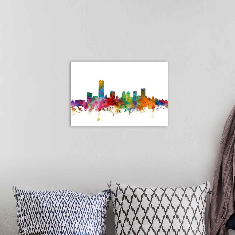 A bohemian room featuring Watercolor artwork of the Oklahoma skyline against a white background.