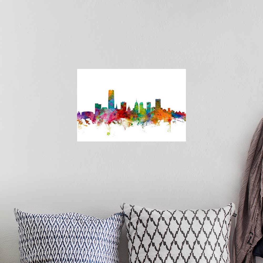 A bohemian room featuring Watercolor artwork of the Oklahoma skyline against a white background.