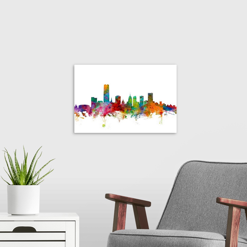 A modern room featuring Watercolor artwork of the Oklahoma skyline against a white background.