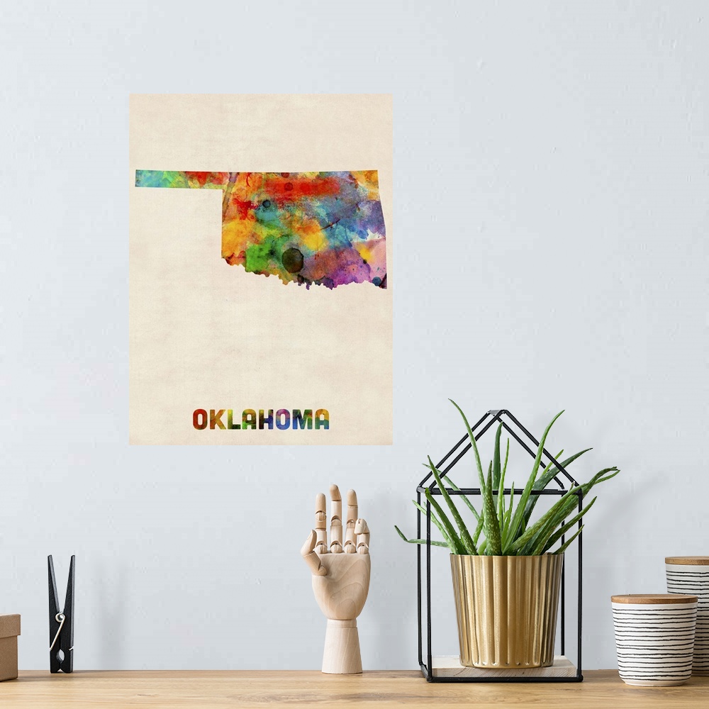 A bohemian room featuring Contemporary piece of artwork of a map of Oklahoma made up of watercolor splashes.