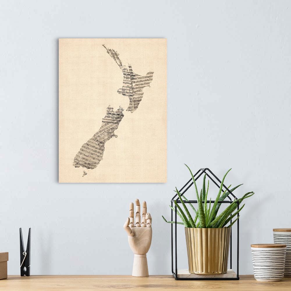 A bohemian room featuring A map of New Zealand made from a collage of old and vintage sheet music, including some handwritt...