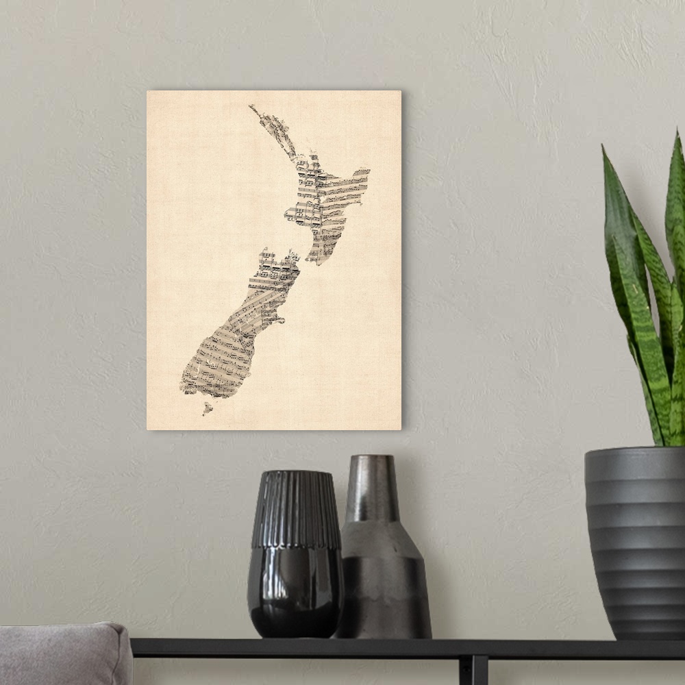 A modern room featuring A map of New Zealand made from a collage of old and vintage sheet music, including some handwritt...