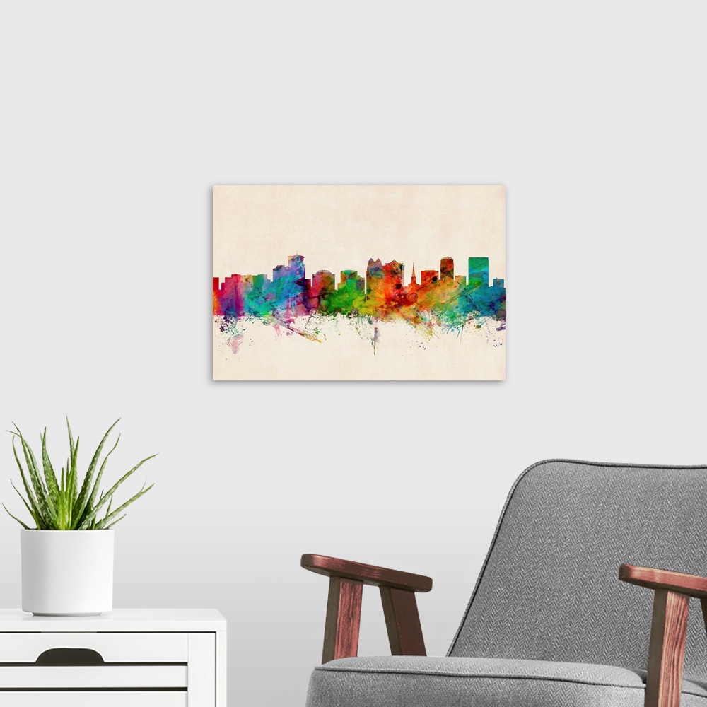 A modern room featuring Contemporary piece of artwork of the Orlando skyline made of colorful paint splashes.