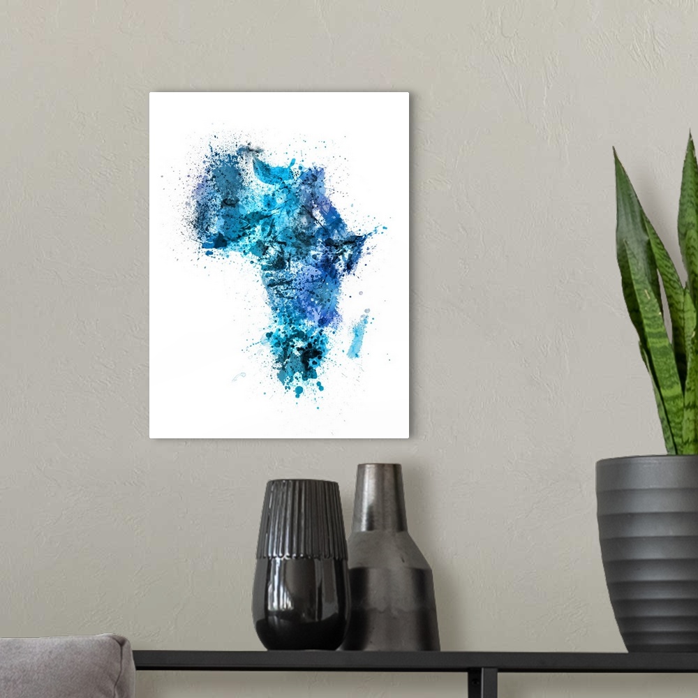 A modern room featuring Contemporary art map of Africa made up of blue watercolor paint splashes.