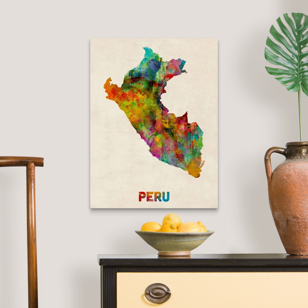 A traditional room featuring Contemporary piece of artwork of a map of Peru made up of watercolor splashes.