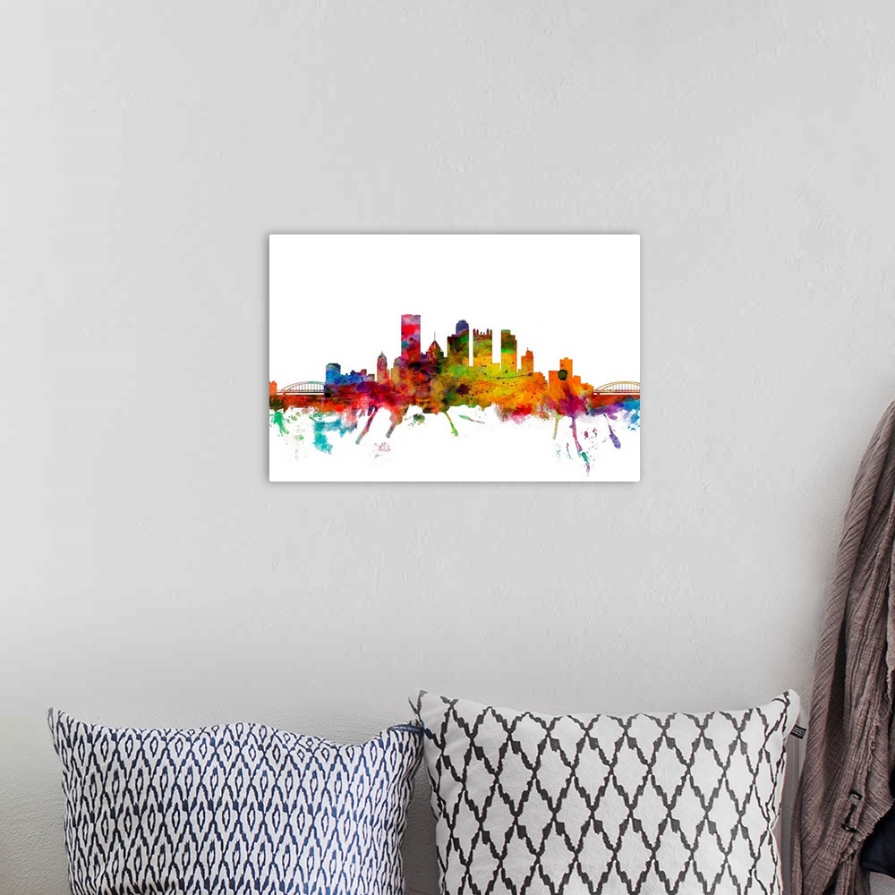 A bohemian room featuring Watercolor artwork of the Pittsburgh skyline against a white background.