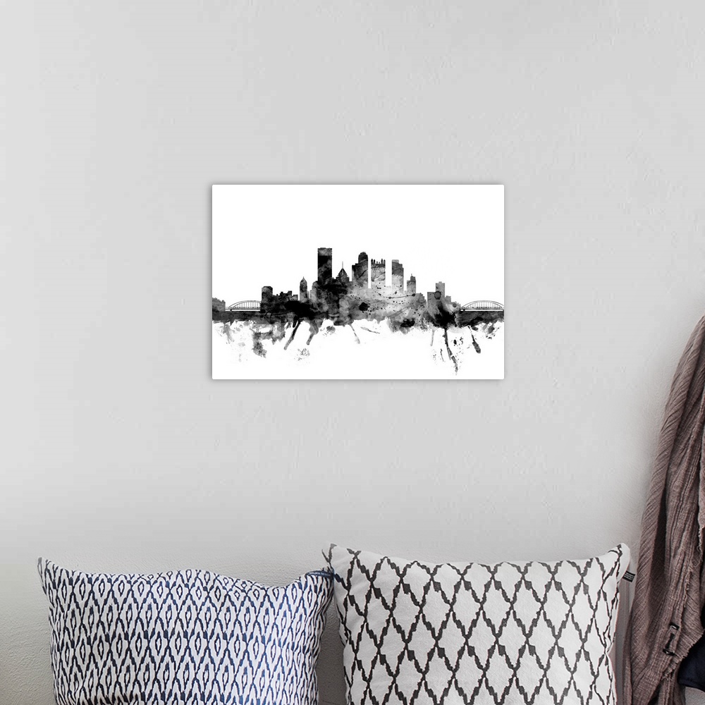 A bohemian room featuring Contemporary artwork of the Pittsburgh city skyline in black watercolor paint splashes.