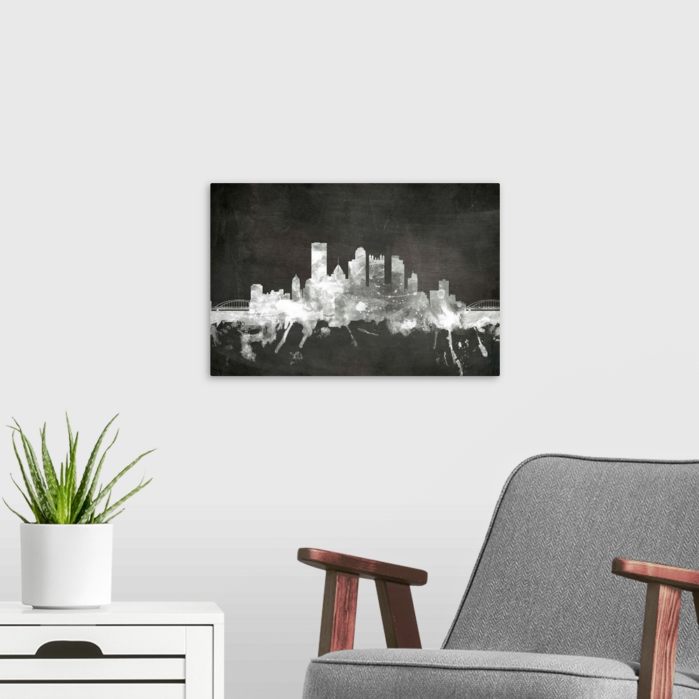 A modern room featuring Smokey dark watercolor silhouette of the Pittsburgh city skyline against chalkboard background.