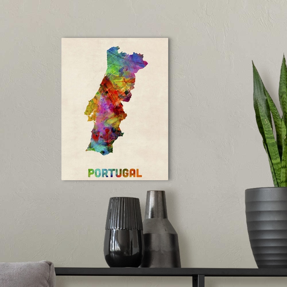A modern room featuring Contemporary piece of artwork of a map of Portugal made up of watercolor splashes.