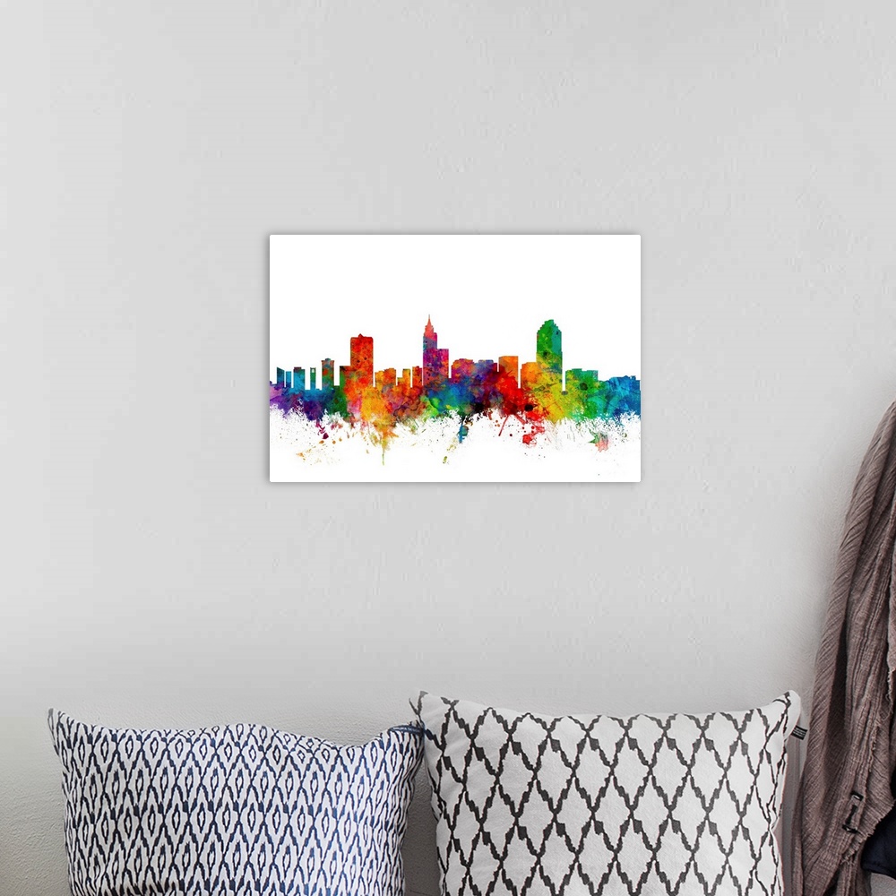 A bohemian room featuring Colorful watercolor splattered silhouetted of the Raleigh city skyline.