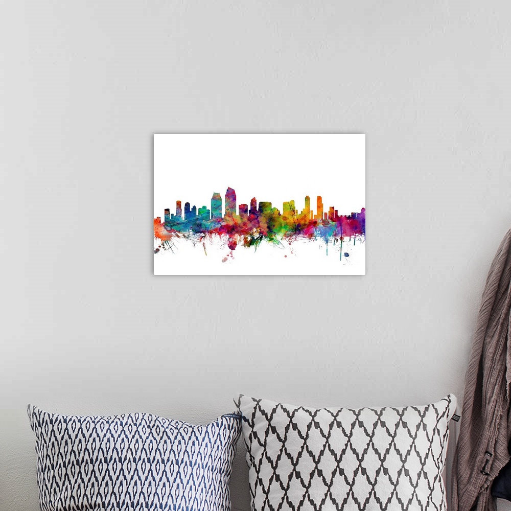 A bohemian room featuring Watercolor artwork of the San Diego skyline against a white background.