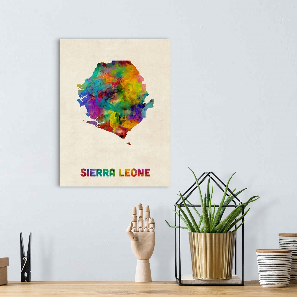 A bohemian room featuring A watercolor map of Sierra Leone.