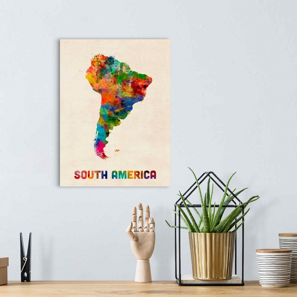 A bohemian room featuring A watercolor map of South America.