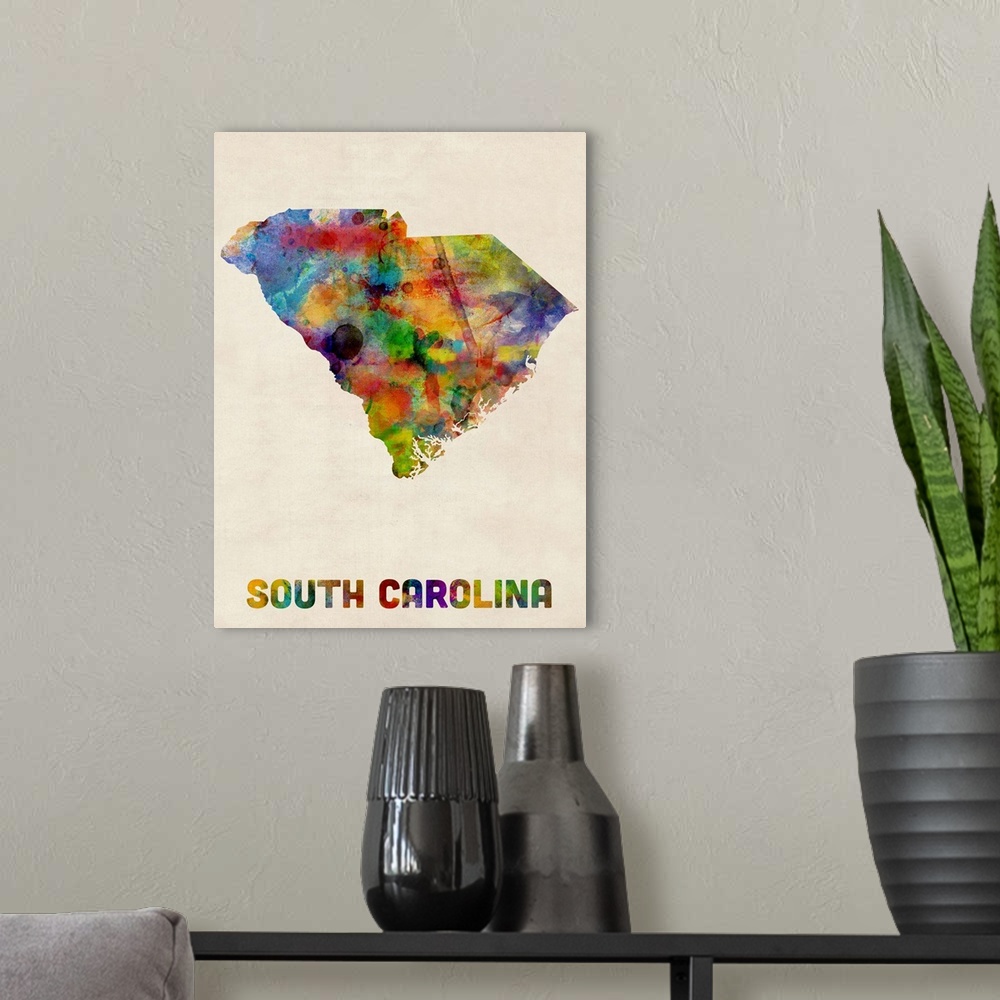 A modern room featuring Contemporary piece of artwork of a map of South Carolina made up of watercolor splashes.