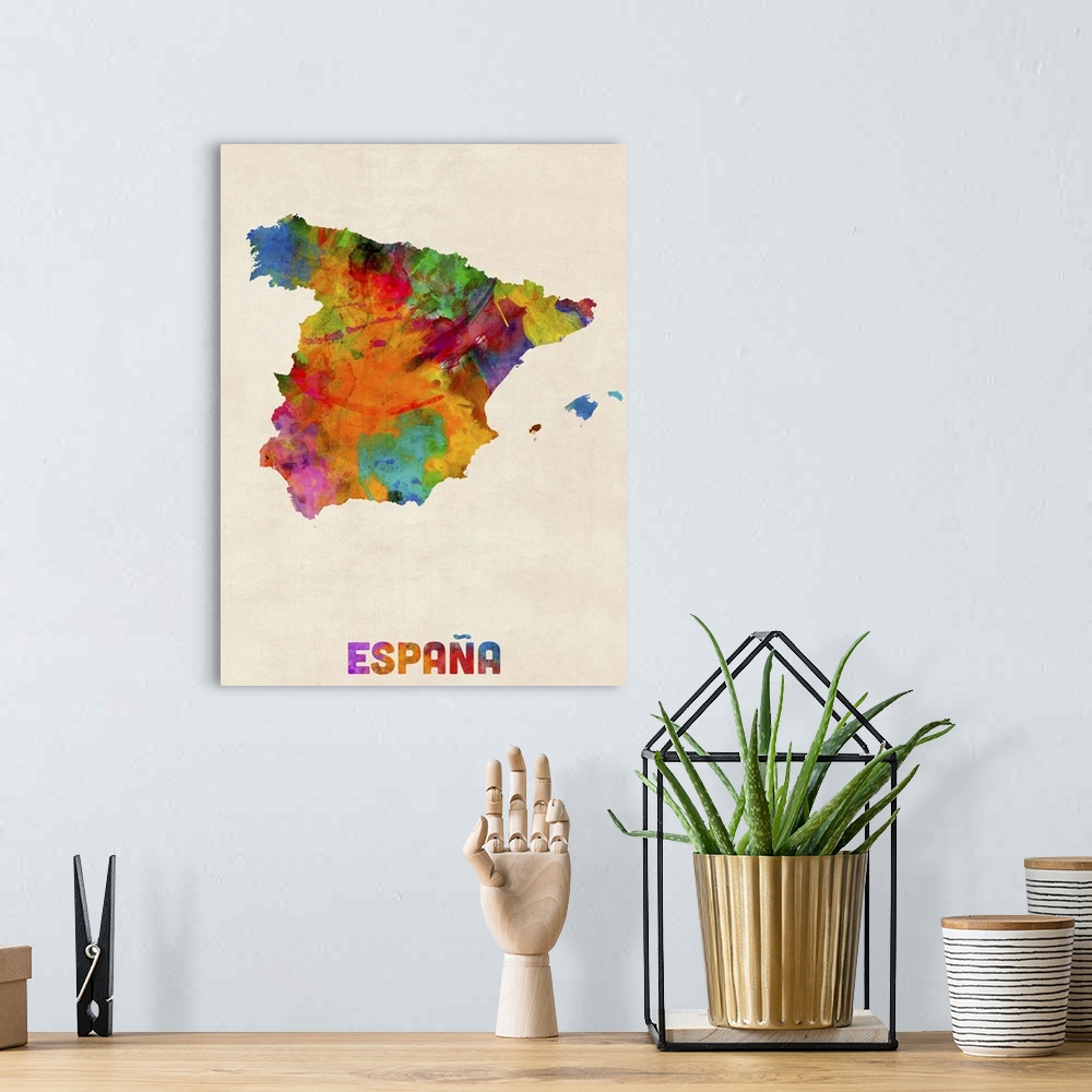 A bohemian room featuring Contemporary piece of artwork of a map of Espana made up of watercolor splashes.
