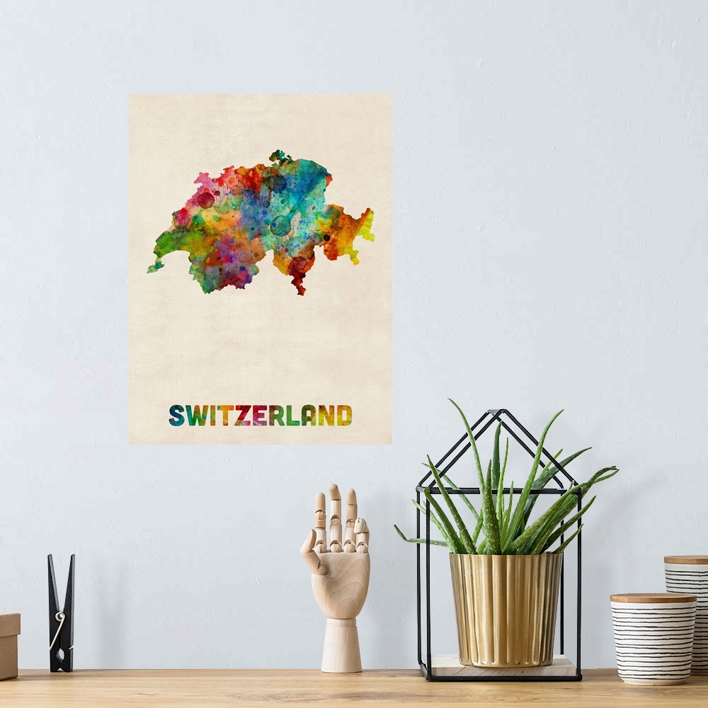 A bohemian room featuring Contemporary piece of artwork of a map of Switzerland made up of watercolor splashes.