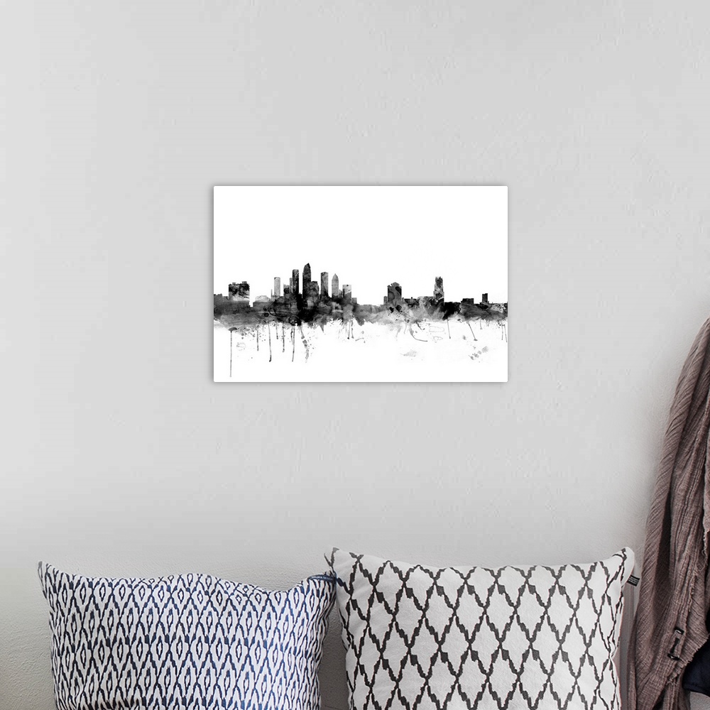 A bohemian room featuring Smokey dark watercolor silhouette of the Tampa city skyline.