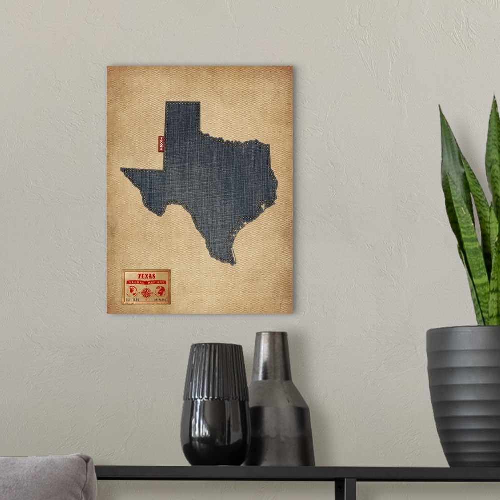 A modern room featuring Contemporary artwork of the state of Texas made of denim, against a rustic background.