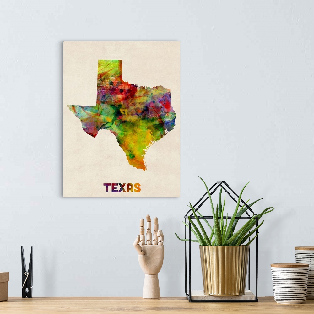 A bohemian room featuring Contemporary piece of artwork of a map of Texas made up of watercolor splashes.