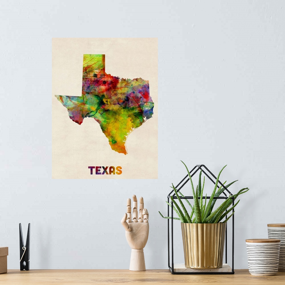 A bohemian room featuring Contemporary piece of artwork of a map of Texas made up of watercolor splashes.