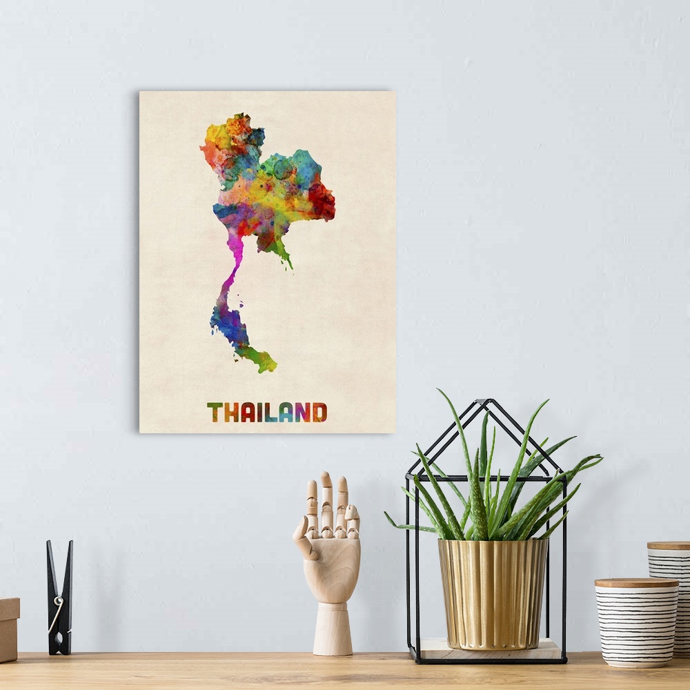 A bohemian room featuring Colorful watercolor art map of Thailand against a distressed background.