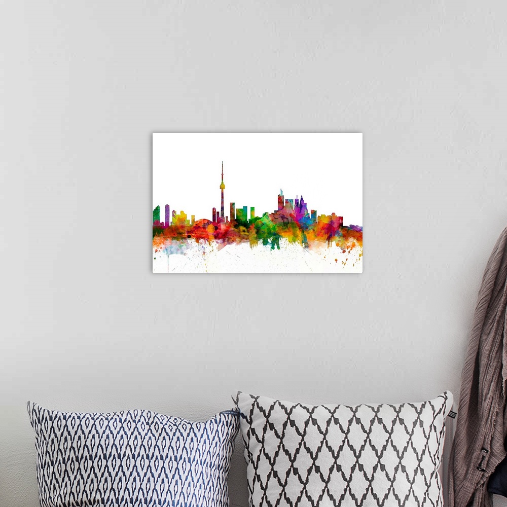 A bohemian room featuring Watercolor artwork of the Toronto skyline against a white background.