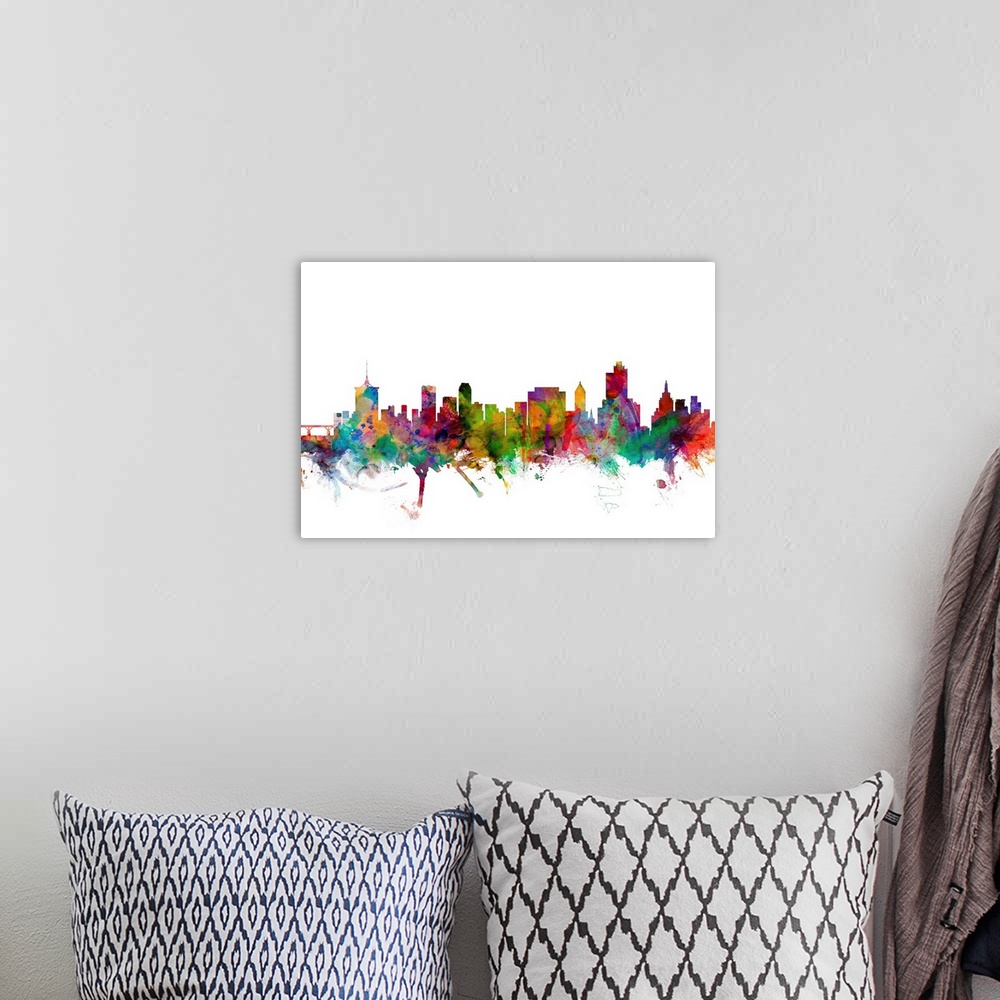 A bohemian room featuring Watercolor artwork of the Tulsa skyline against a white background.
