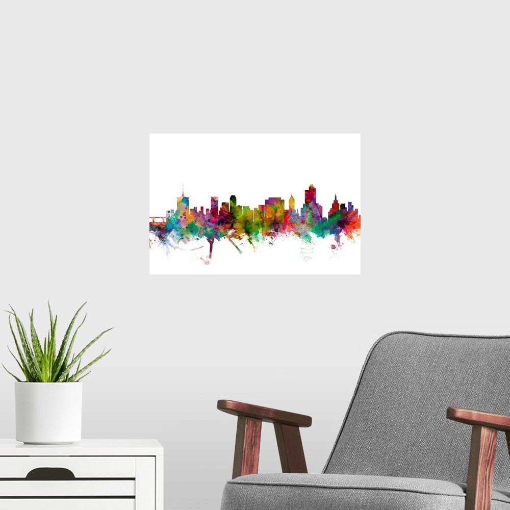 A modern room featuring Watercolor artwork of the Tulsa skyline against a white background.