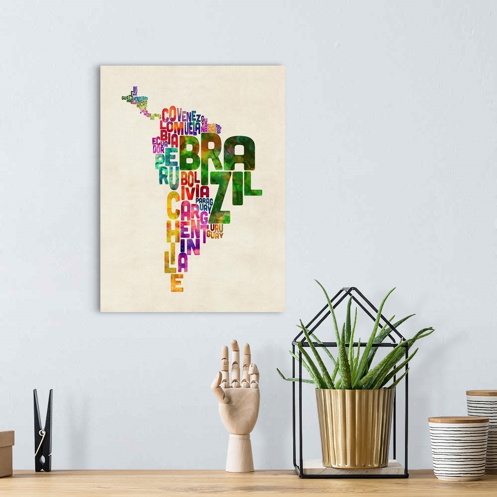 A bohemian room featuring A typographic text map of Central and South America in an urban watercolor style. Each country is...