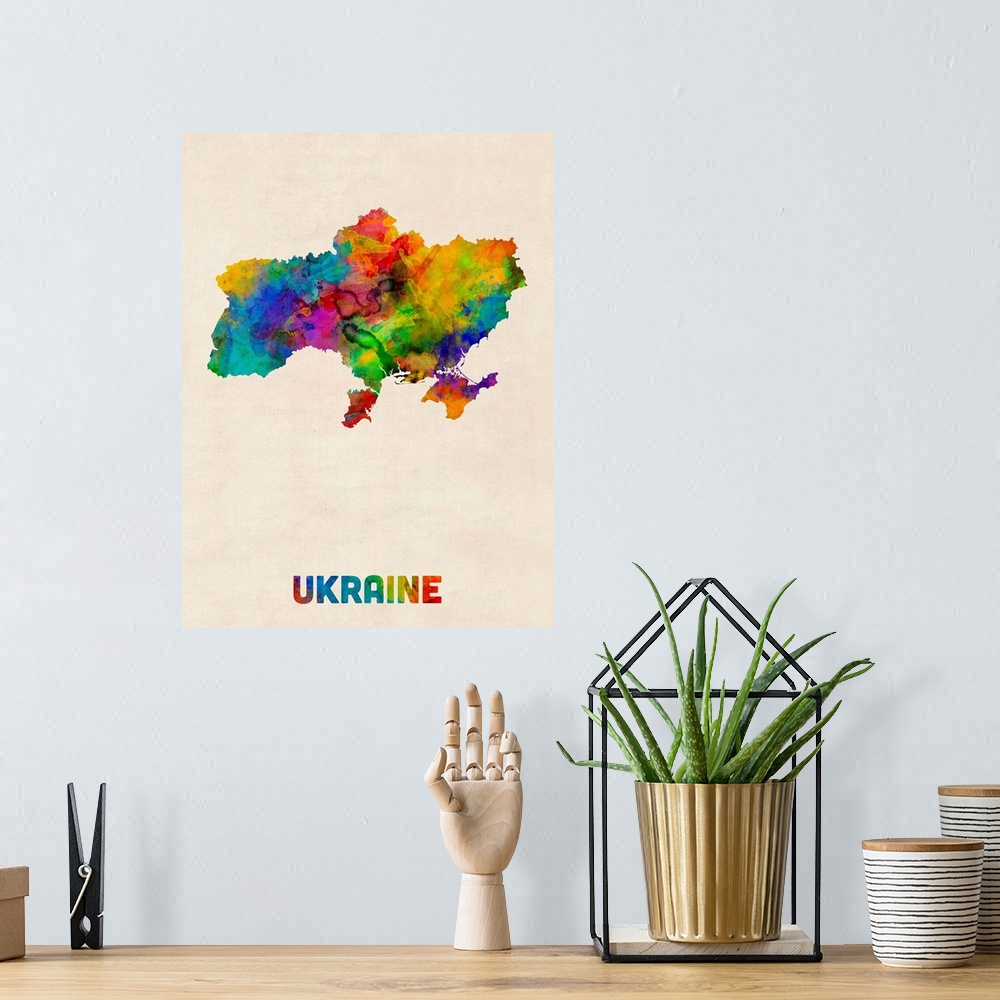 A bohemian room featuring Colorful watercolor art map of Ukraine against a distressed background.