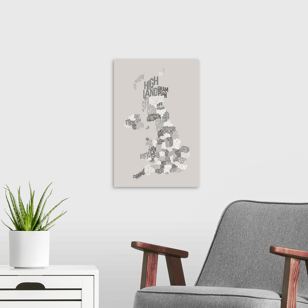 A modern room featuring United Kingdom text map made up of county names - monochrome