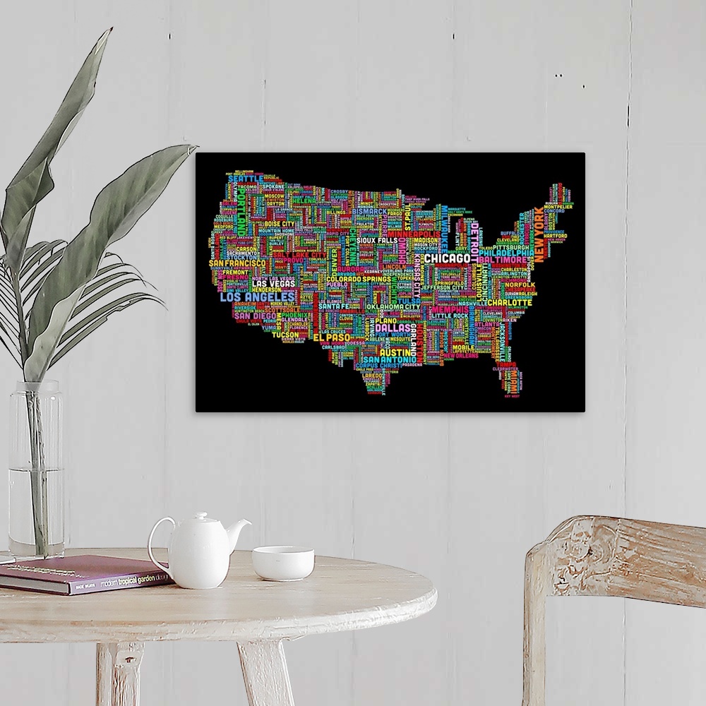 A farmhouse room featuring Colorful map of America made of the names of each city that corresponds to its location.