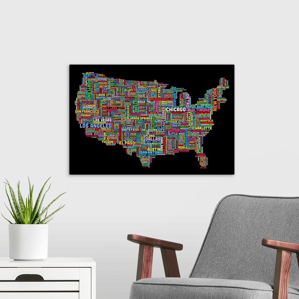 A modern room featuring Colorful map of America made of the names of each city that corresponds to its location.