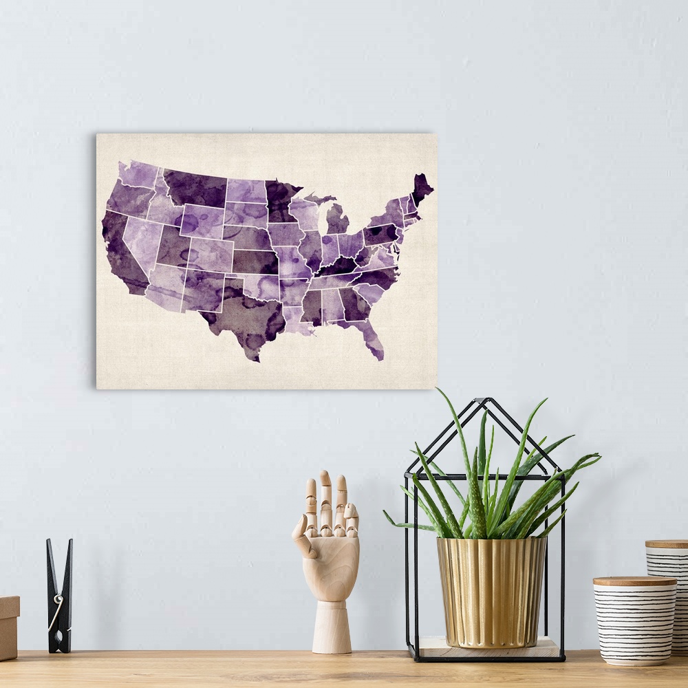 A bohemian room featuring Contemporary artwork of a map of the United States in purple watercolor tones.