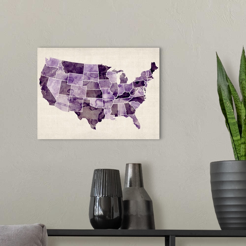 A modern room featuring Contemporary artwork of a map of the United States in purple watercolor tones.