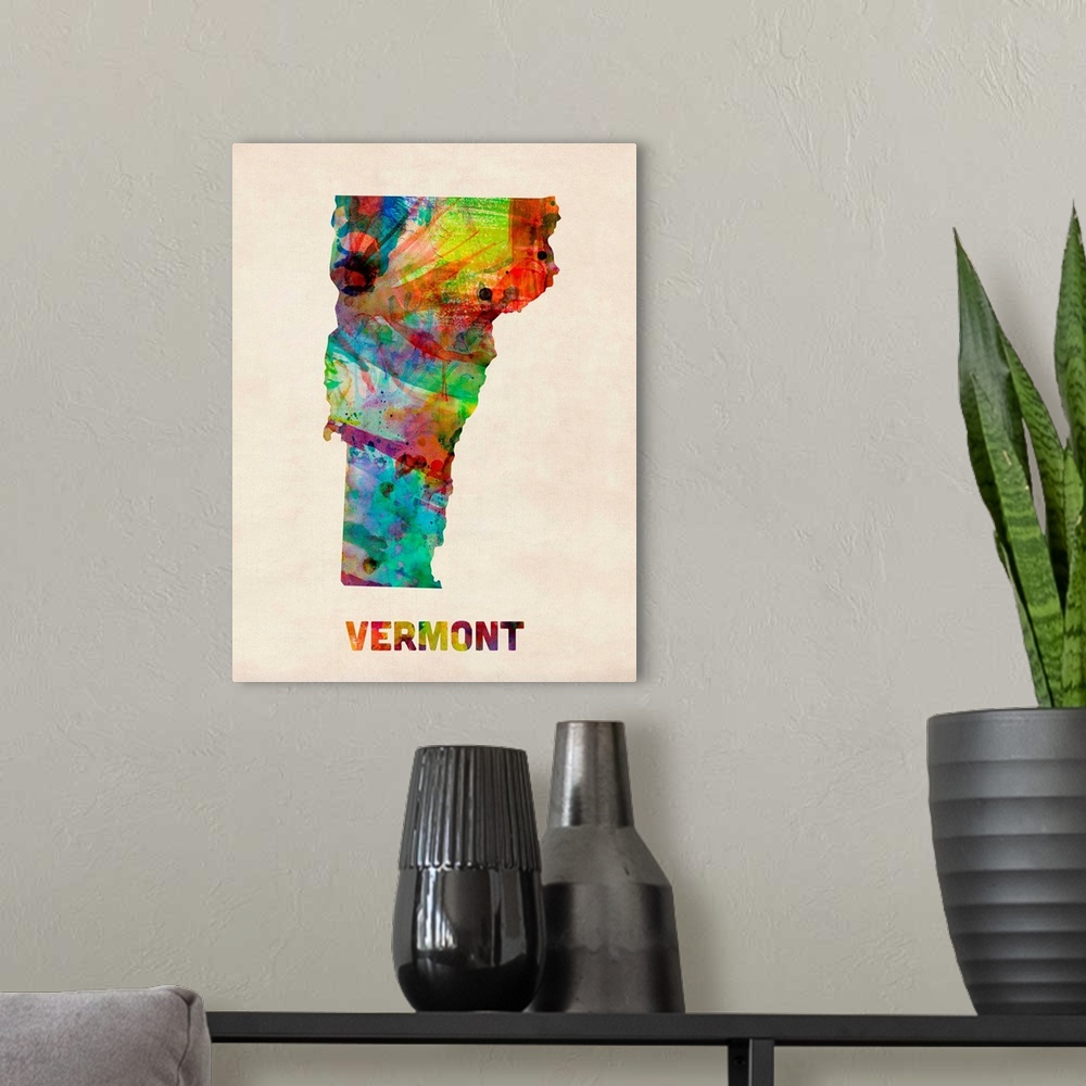 A modern room featuring Contemporary piece of artwork of a map of Vermont made up of watercolor splashes.