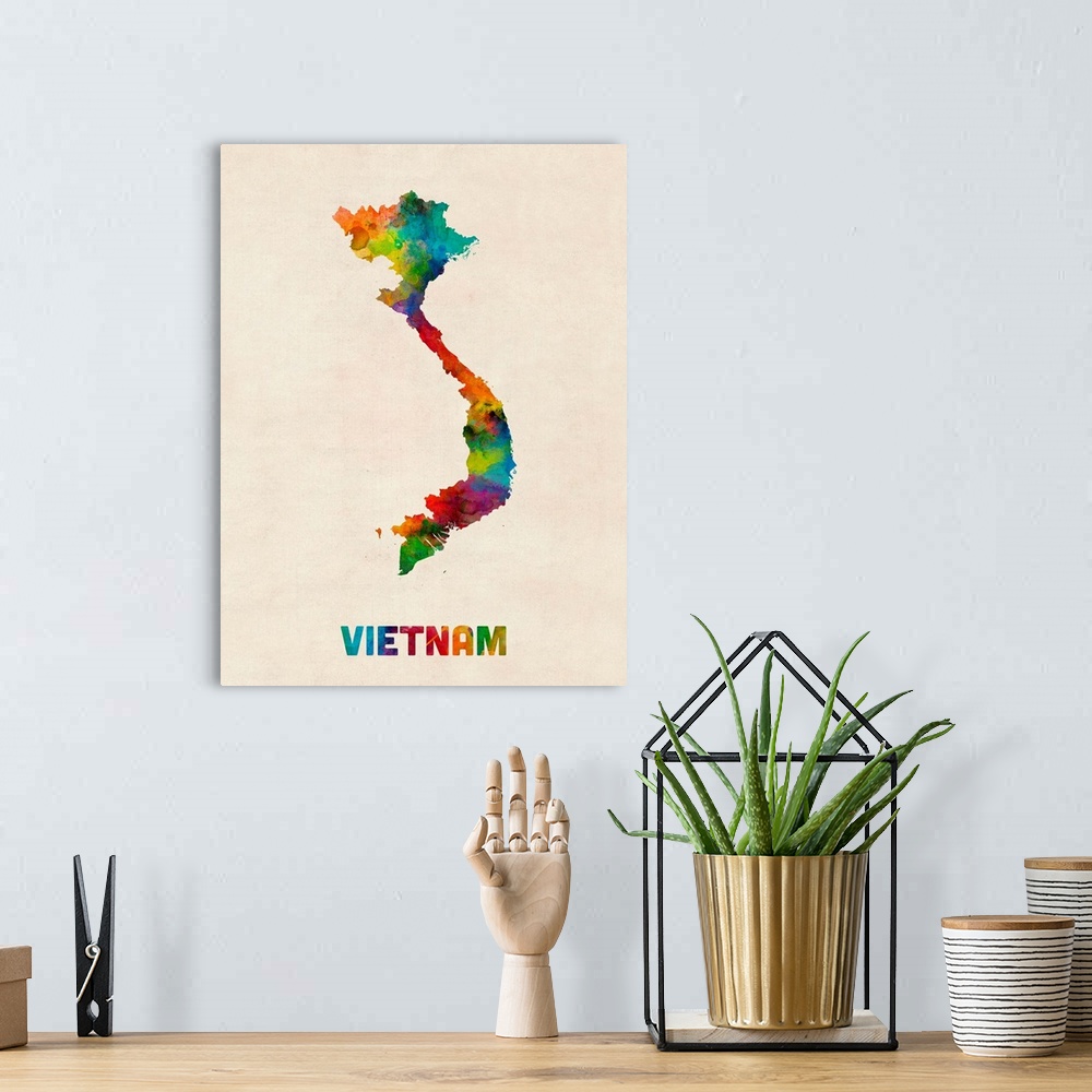 A bohemian room featuring Colorful watercolor art map of Vietnam against a distressed background.