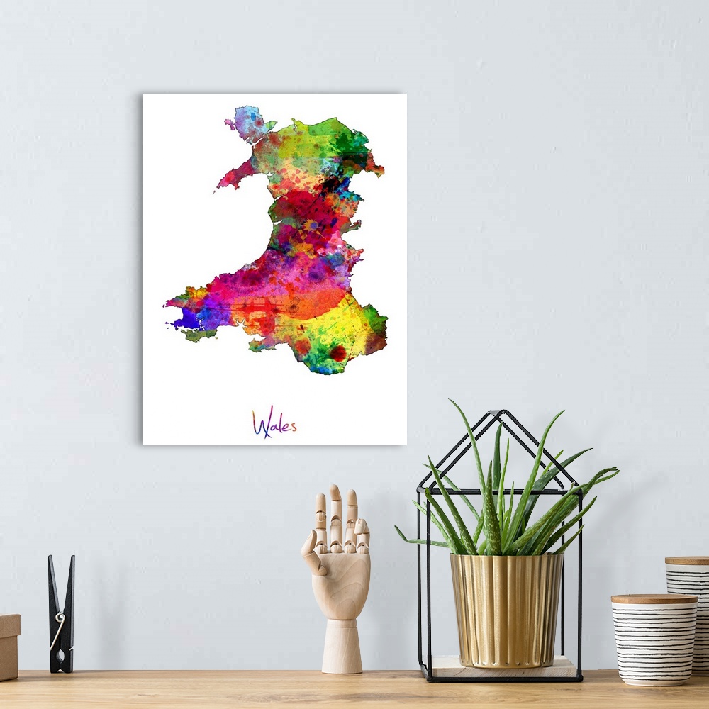 A bohemian room featuring Watercolor art map of the country Wales against a white background.