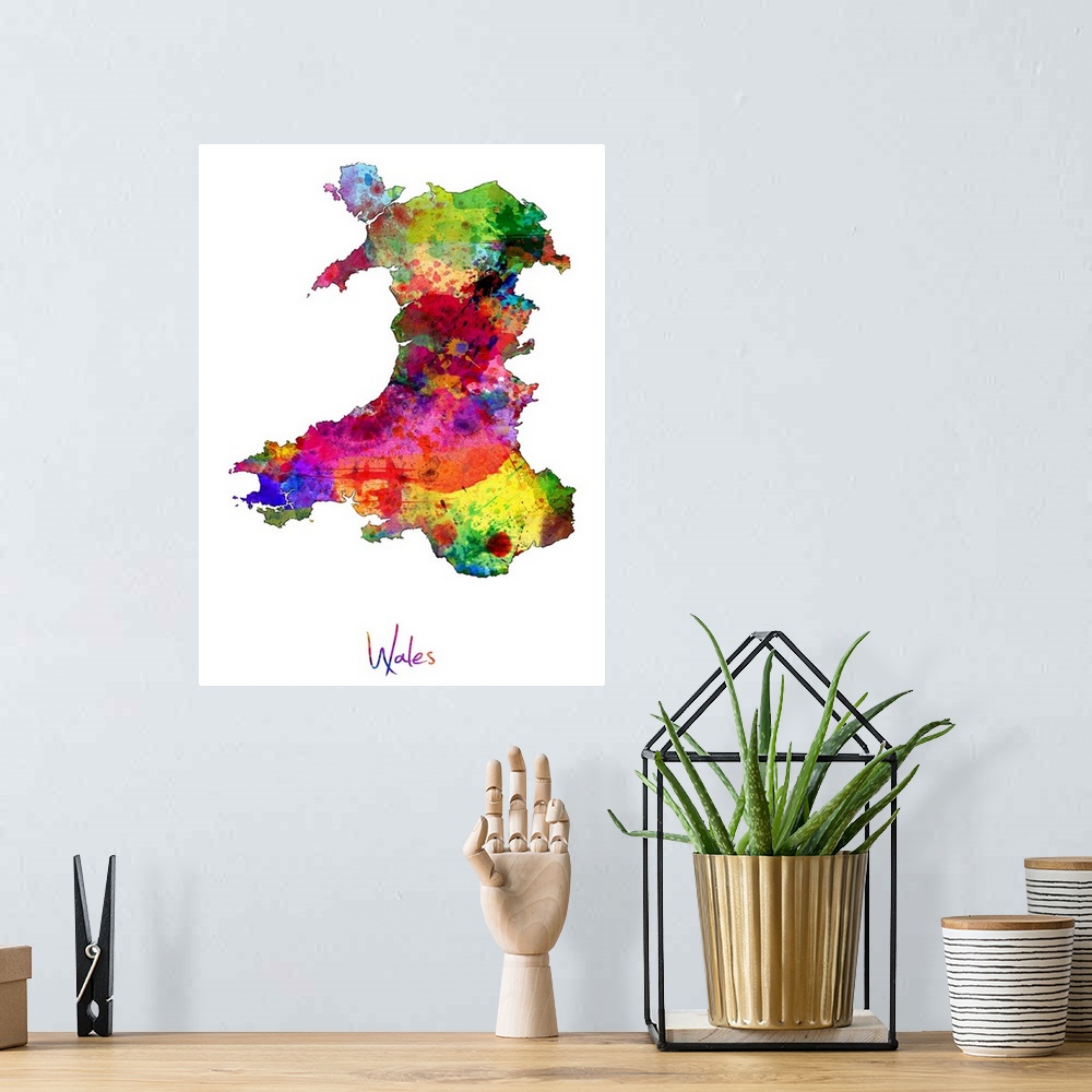 A bohemian room featuring Watercolor art map of the country Wales against a white background.