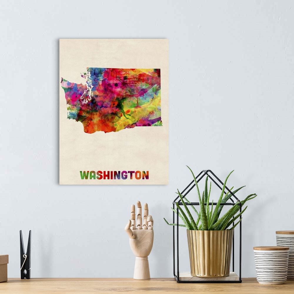 A bohemian room featuring Contemporary piece of artwork of a map of Washington made up of watercolor splashes.