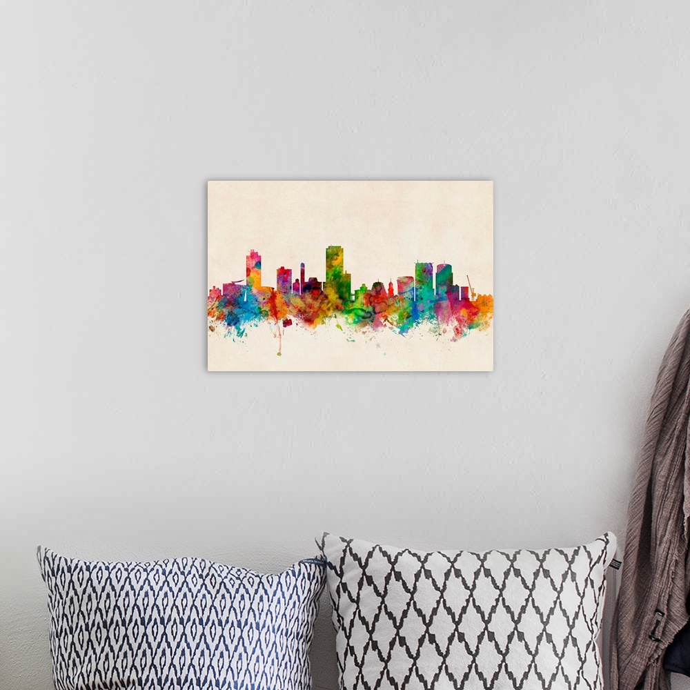 A bohemian room featuring Contemporary piece of artwork of the Wellington, New Zealand skyline made of colorful paint splas...