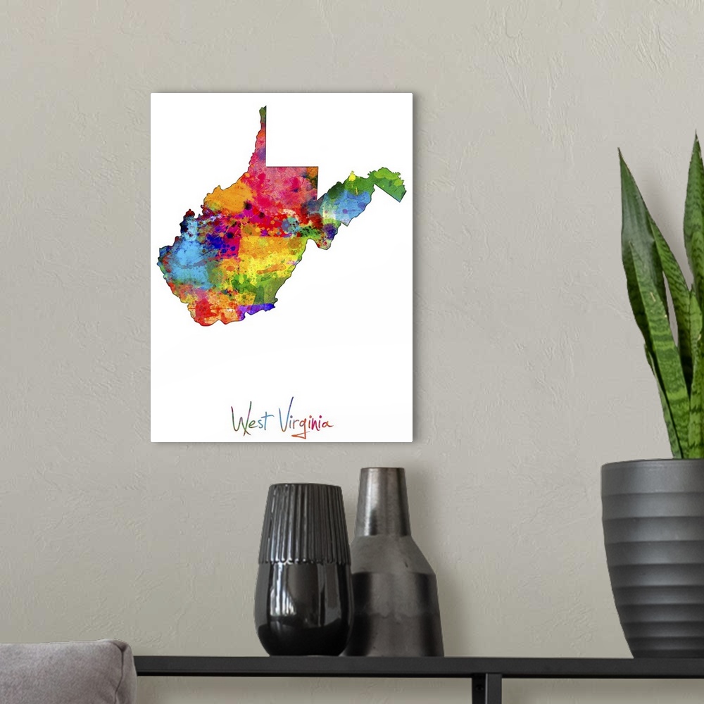 A modern room featuring Contemporary artwork of a map of West Virginia made of colorful paint splashes.