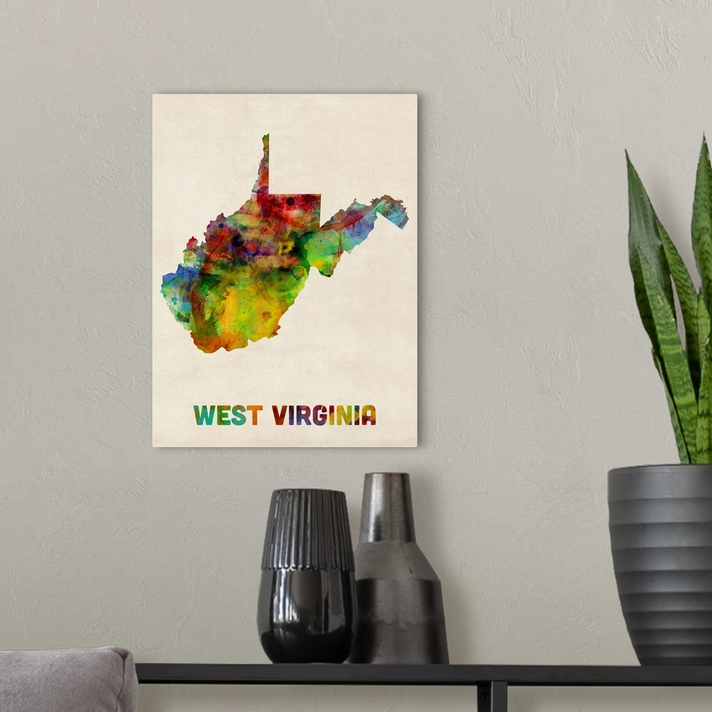 A modern room featuring Contemporary piece of artwork of a map of West Virginia made up of watercolor splashes.