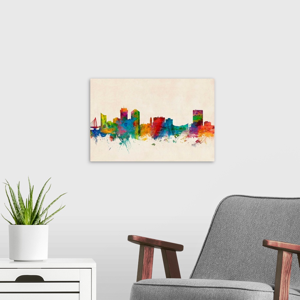 A modern room featuring Contemporary piece of artwork of the Wichita skyline made of colorful paint splashes.