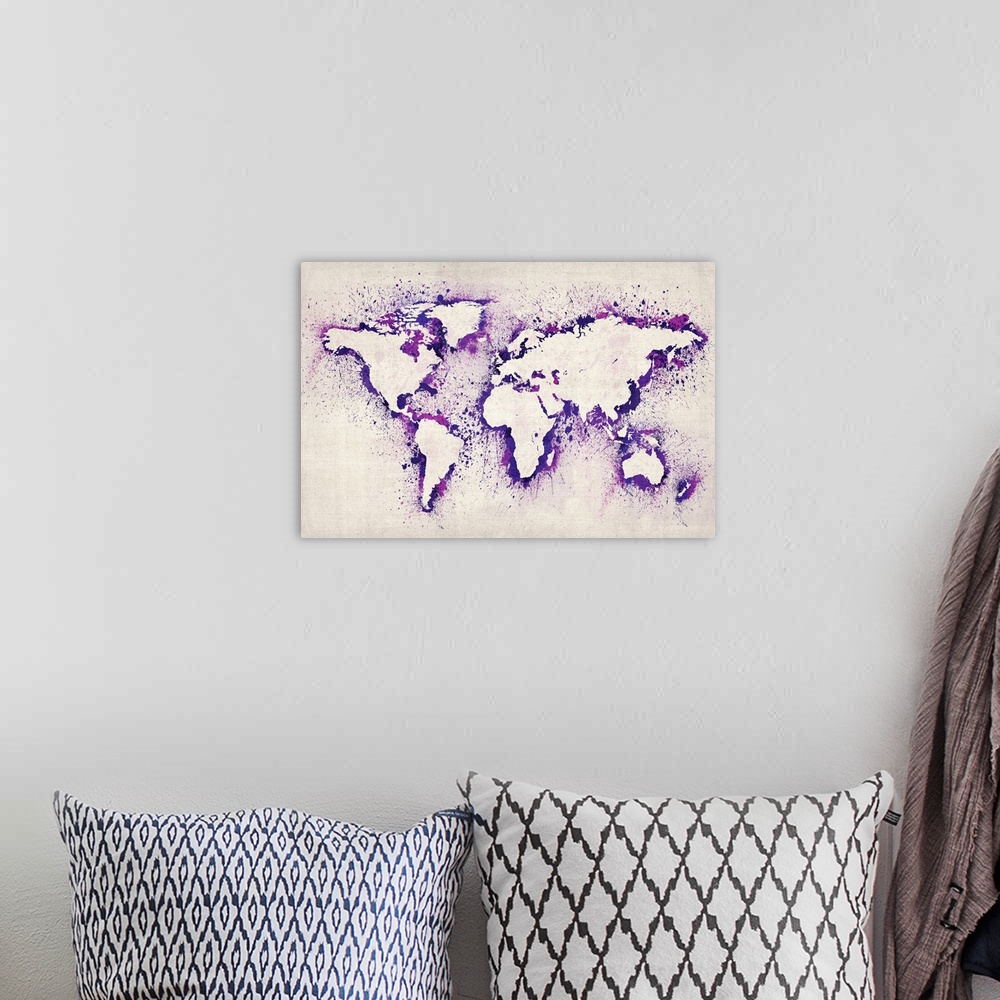 A bohemian room featuring Artwork of a map of the continents created from stenciled ink splashes.