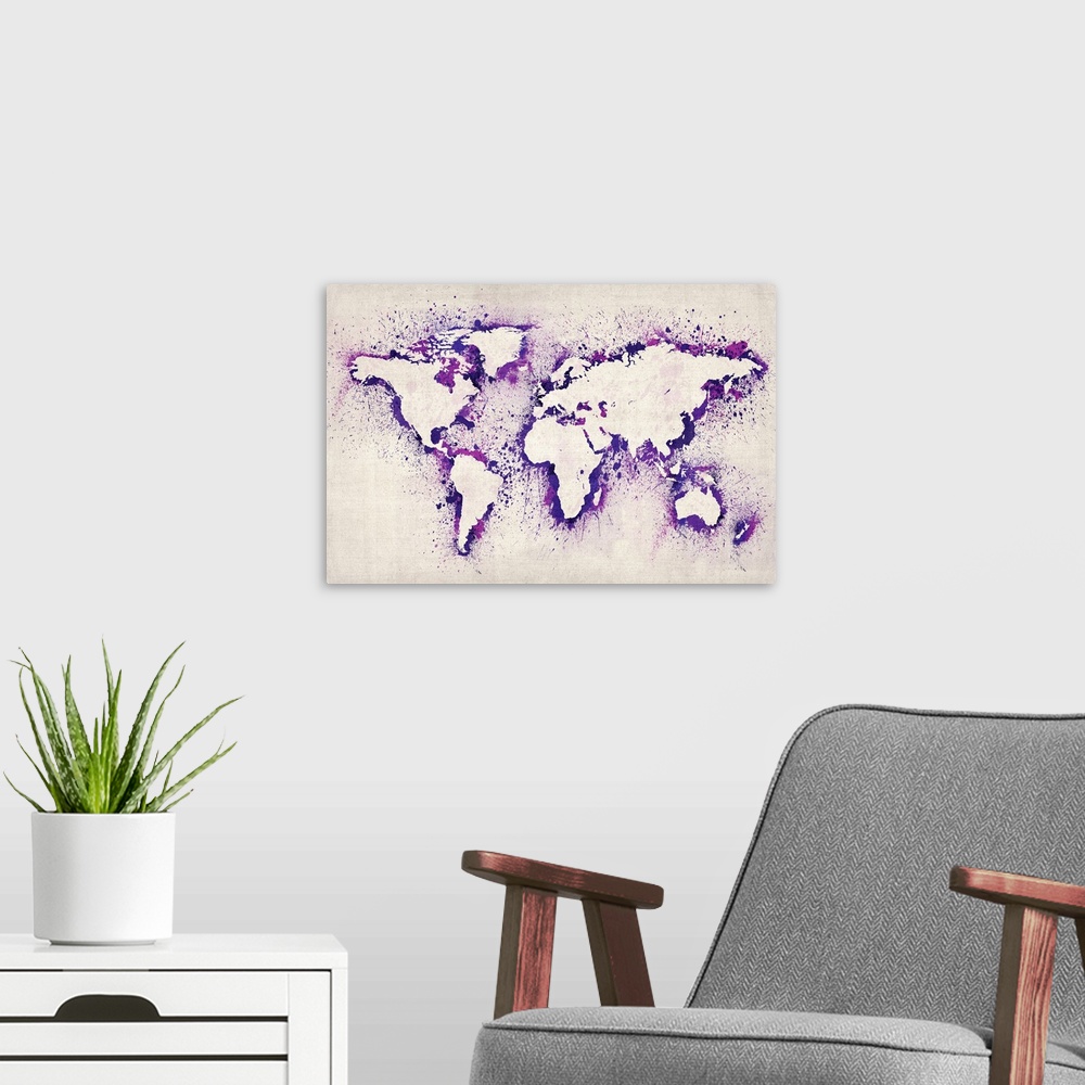 A modern room featuring Artwork of a map of the continents created from stenciled ink splashes.