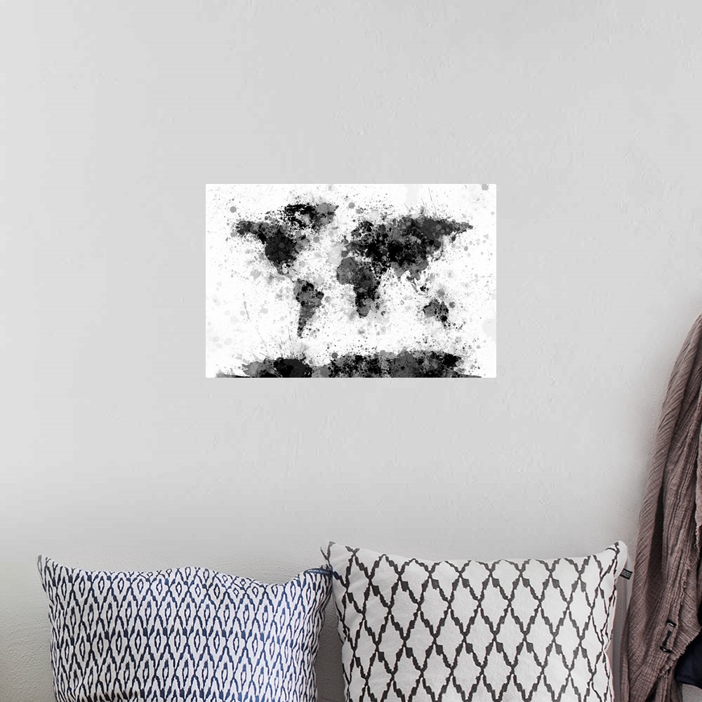 A bohemian room featuring Contemporary artwork of a world map made from black and gray toned paint splatters.
